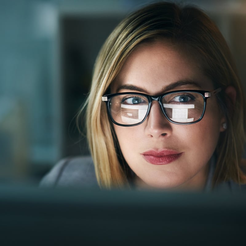Employee on video call with internal team. 
