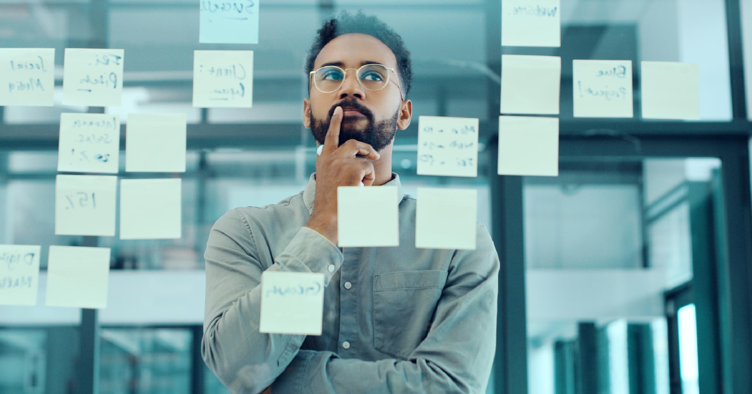 Person with sticky notes of problems