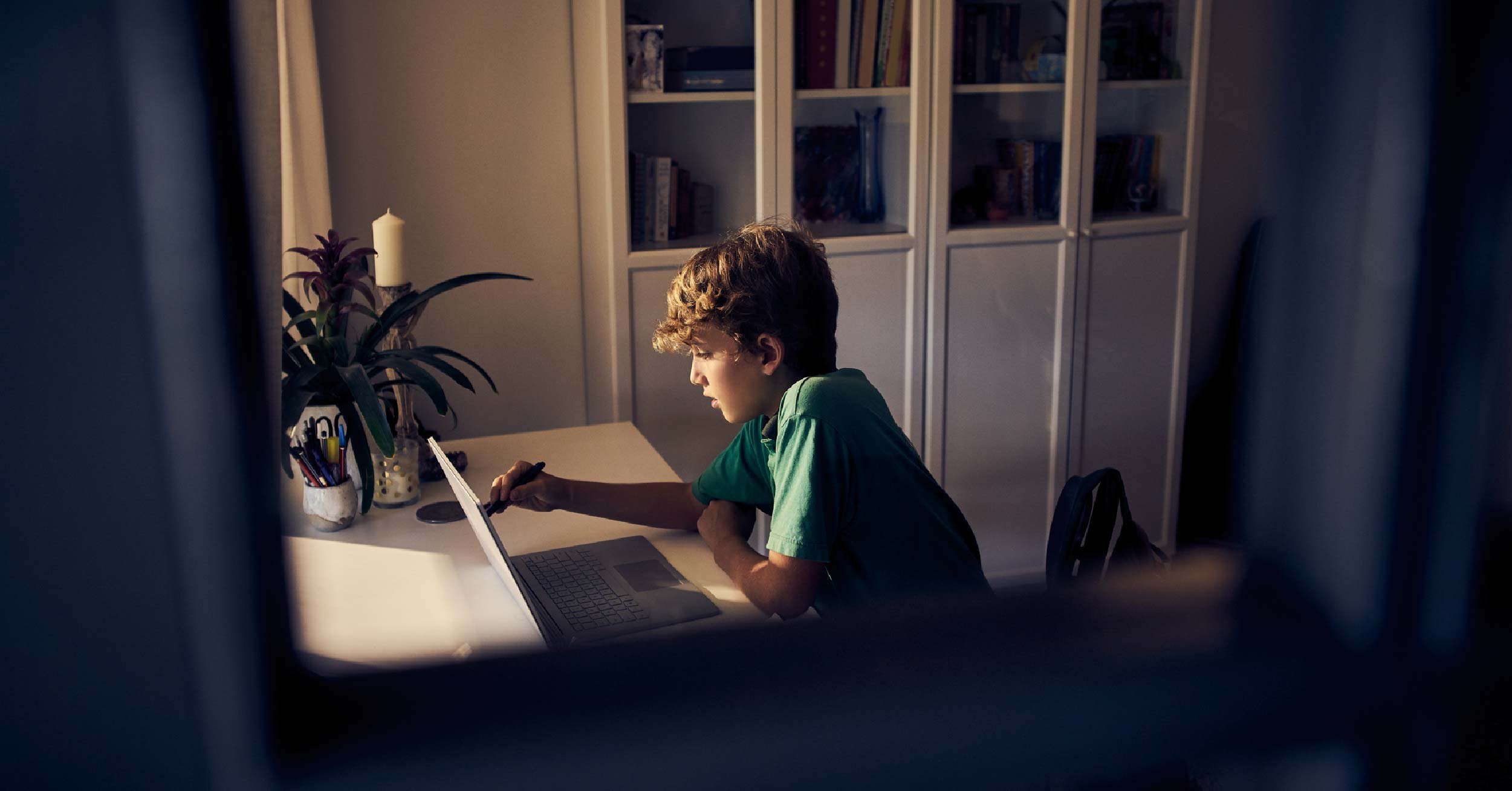Kid using computer.