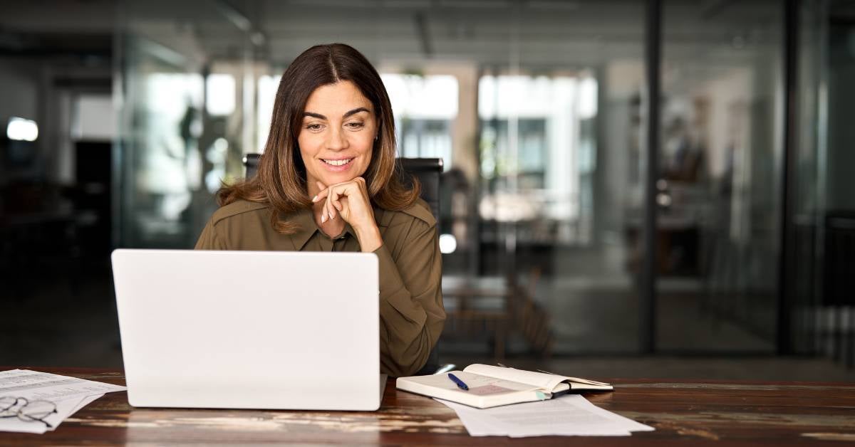 A business owner researches print management software solutions