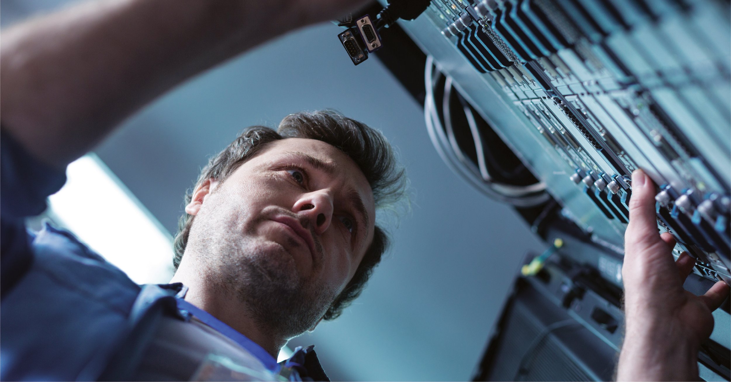 An IT pro working on outdated tech at a small to midsized business.