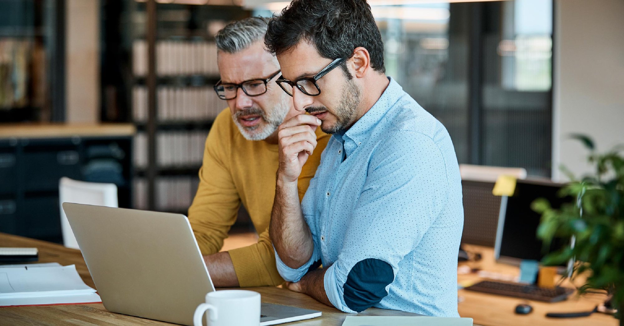 business partners comparing