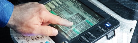 Employee using office printer. 