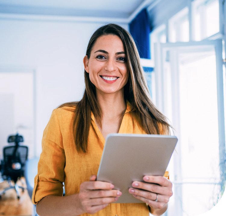 Smiling woman holding tablet