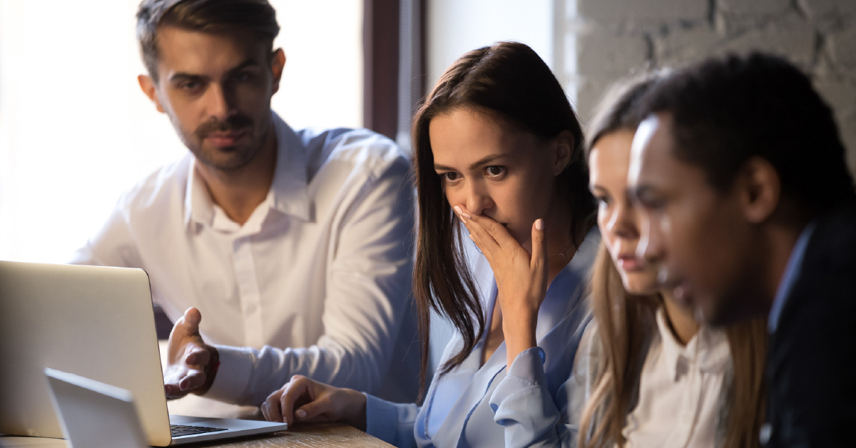 A group of surprised employees reacting to Quocirca's 2023 print security report.