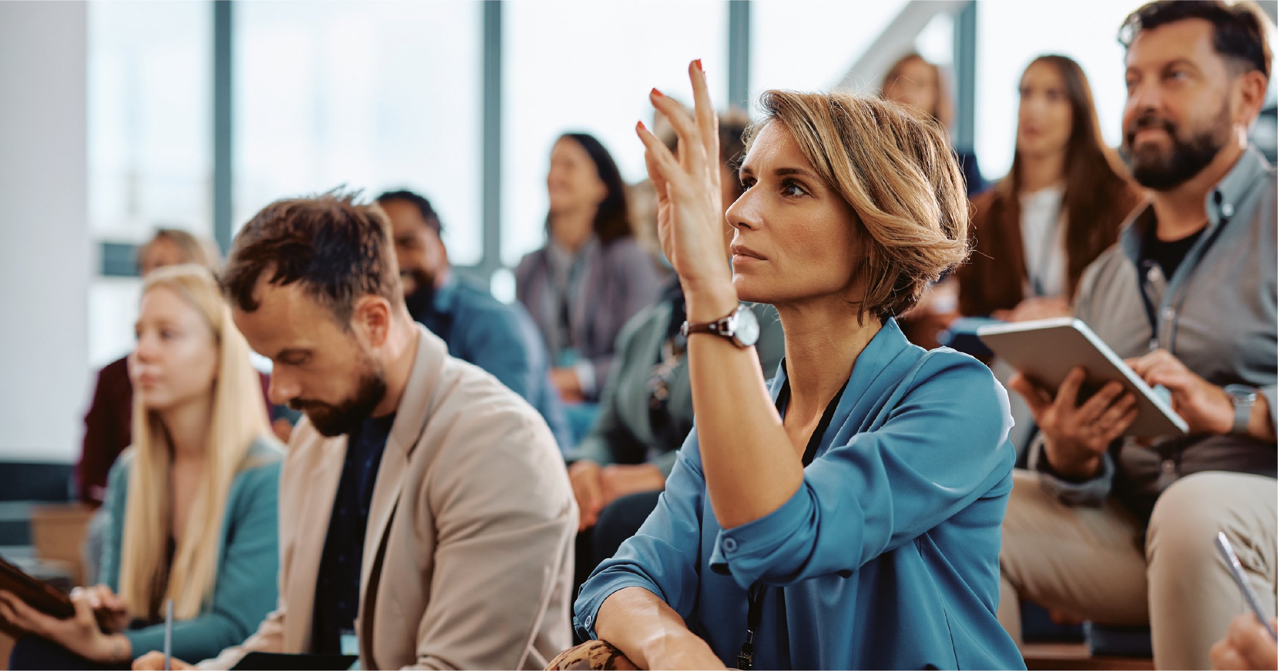 Employee asking a question during security awareness training. 