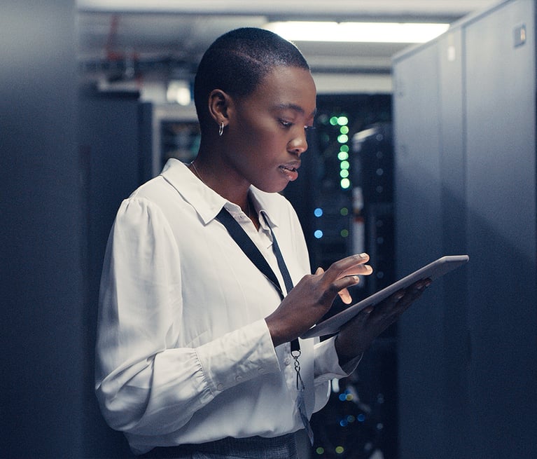 Woman with tablet in IT and security
