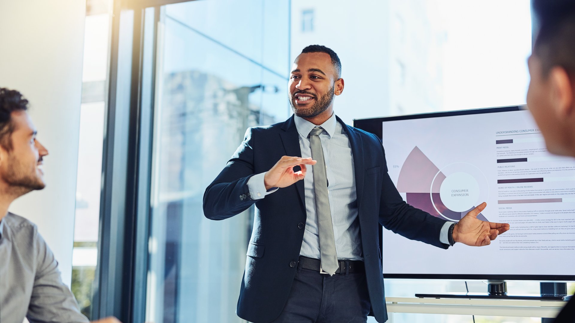 Employee presenting to business owners.