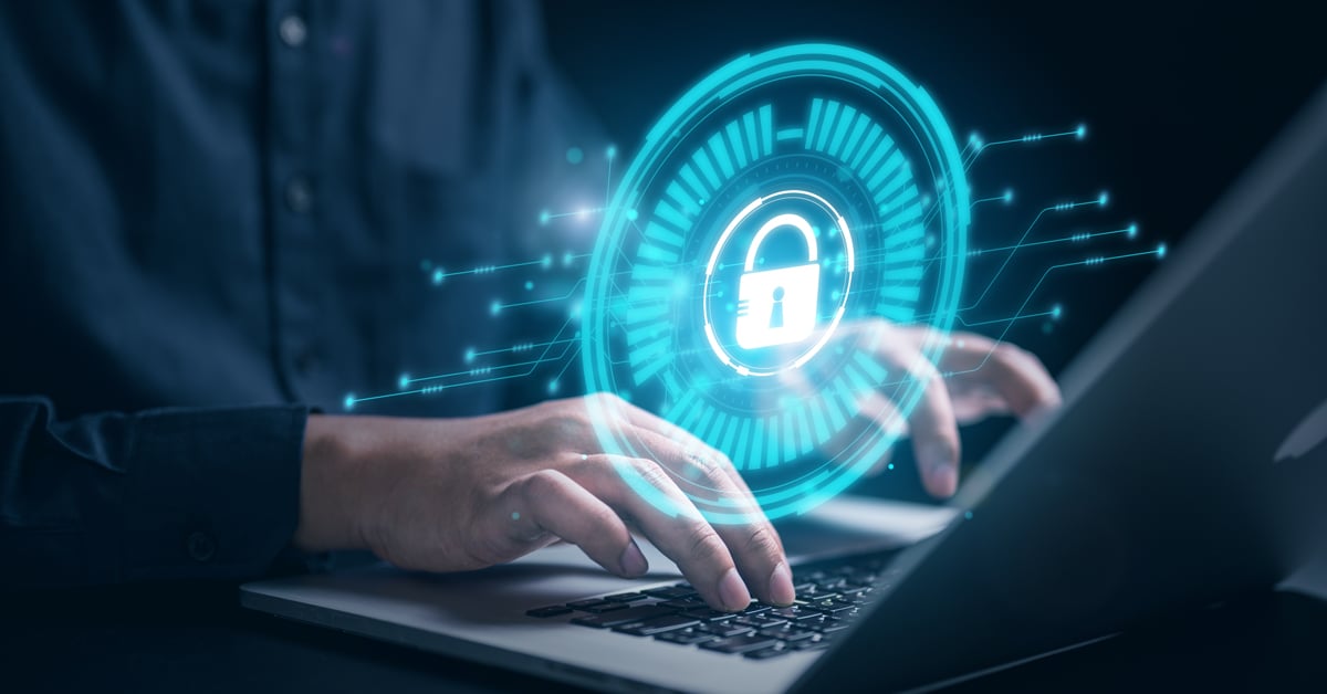 Cybersecurity lock above laptop. 